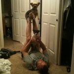Kristopher Lauchner playing with dogs