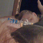 Desiree Capuano sleeping, with a foot in her face