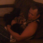 Kristopher Lauchner snuggling with our mangy dog