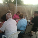Desiree's extended family having a backyard dinner