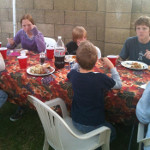 Desiree's extended family having a backyard dinner