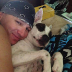 Kristopher Lauchner being affectionate with another mangy dog